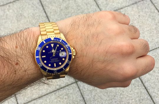 Rolex Submariner Gold mit blauem Zifferblatt und President Goldband