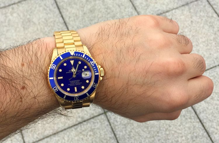 Rolex Submariner Gold mit blauem Zifferblatt und President Goldband